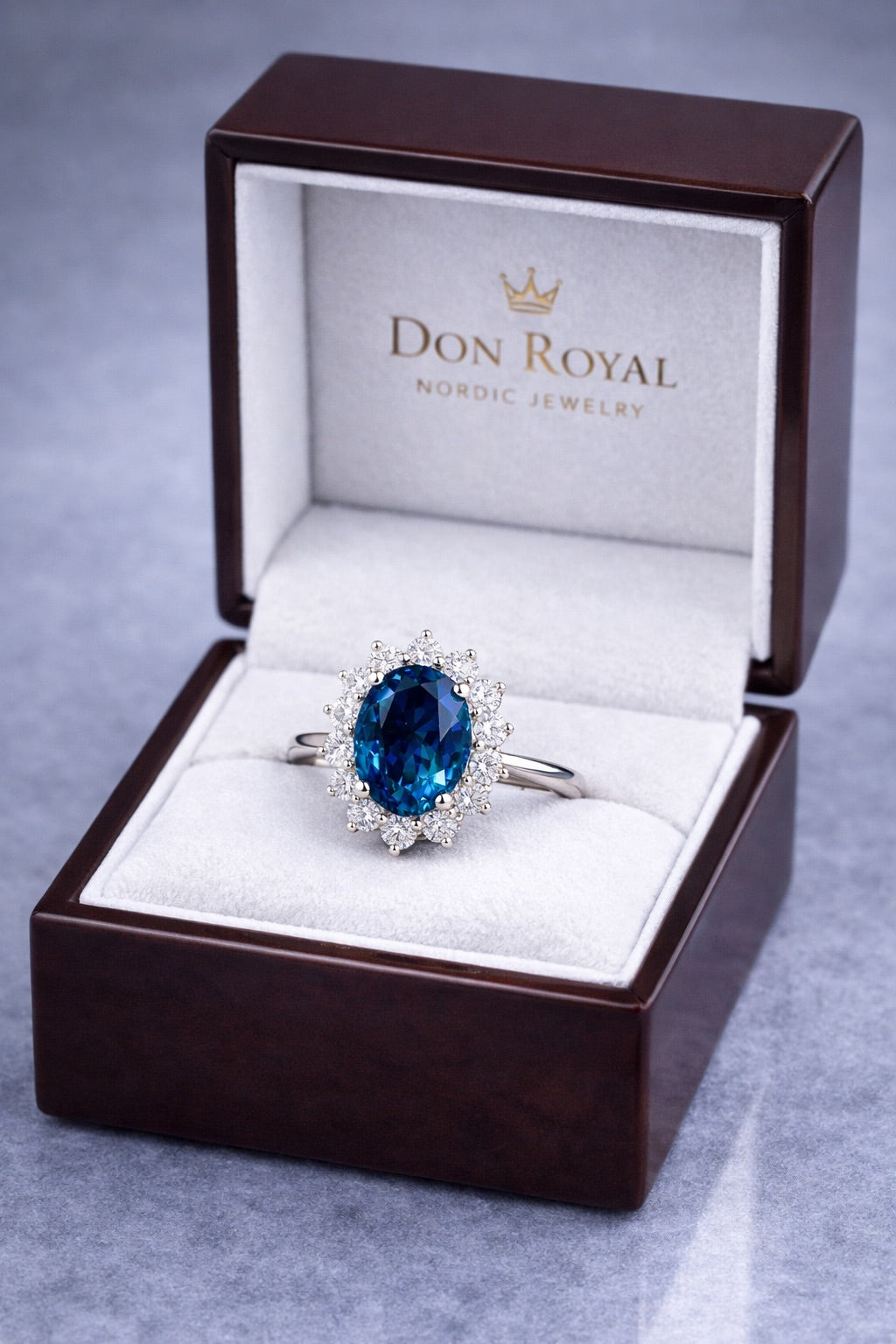 Unheated blue sapphire halo ring in white gold box