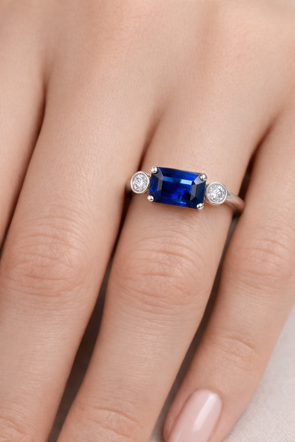 Royal Blue sapphire three-stone ring 1.63 ct in white gold on hand